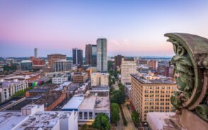 Photo of the skyline of Birmingham AL during the overall best time to visit with blue skies setting over the perfect weather at dusk