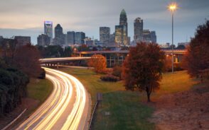 Skyline in Charlotte pictured during the best time to visit with Us-74 in the middle at dusk