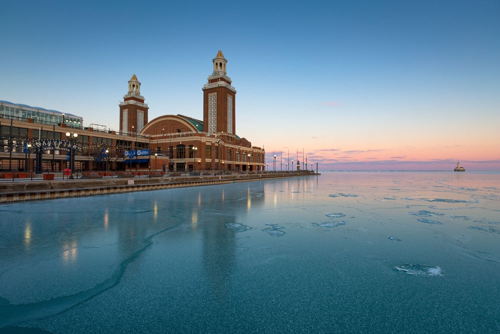 Photo of the Navy Pier pictured with ice on the lake during the winter, the overall cheapest, least busy, and worst time to visit Chicago