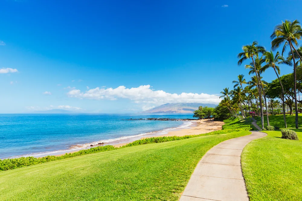 Wailea Beach Path, pictured mid-day under blue skies, pictured as one of the best Maui whale watching spots